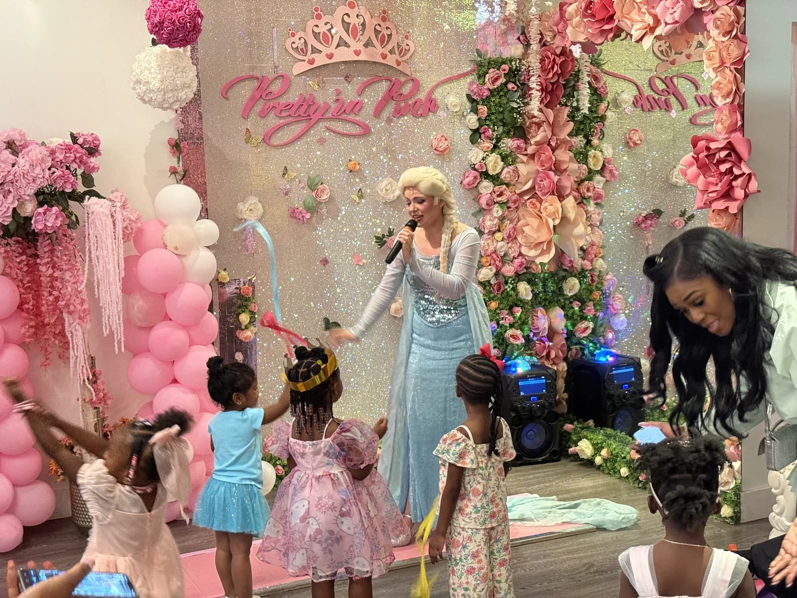 Elsa princess character with girls in princess dresses at Disney princess birthday party Fort Lauderdale