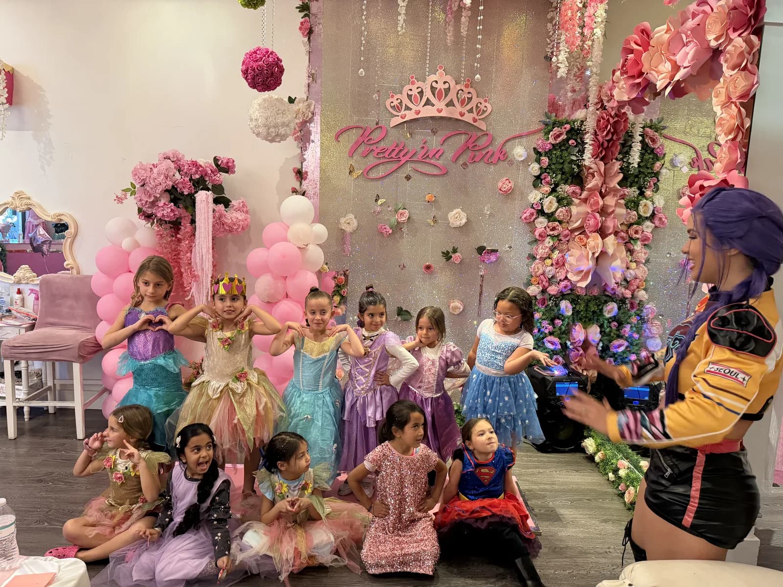 Girls in princess dresses posing at princess birthday party in South Florida at Pretty in Pink